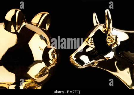 A Gold Pig And A Gold Bull Stock Photo