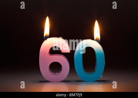 Two Candles In The Shape Of The Number 60 Stock Photo