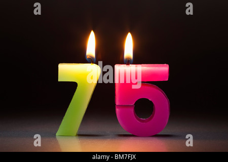 Two Candles In The Shape Of The Number 75 Stock Photo