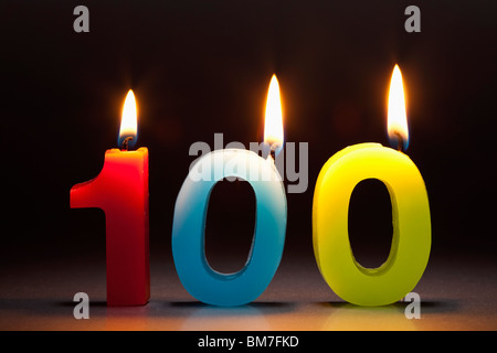 Three Candles In The Shape Of The Number 100 Stock Photo