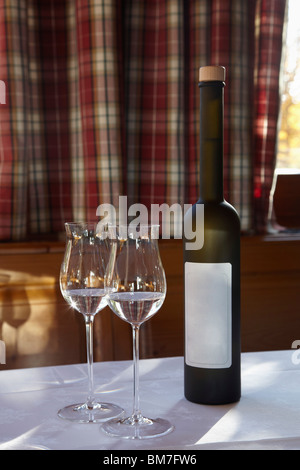 Two glasses and a bottle of Schnapps Stock Photo