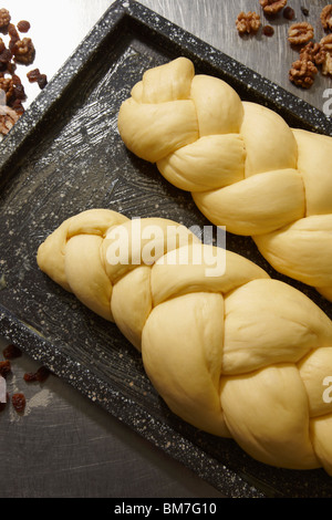 Two loaves of braided bread waiting to be baked Stock Photo