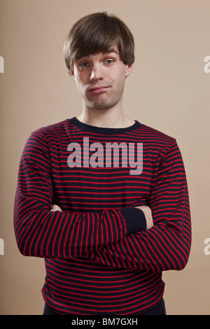 Portrait of a man looking doubtful, studio shot Stock Photo