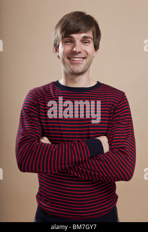 Portrait of a man looking happy, studio shot Stock Photo