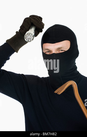 A thief wearing a balaclava Stock Photo