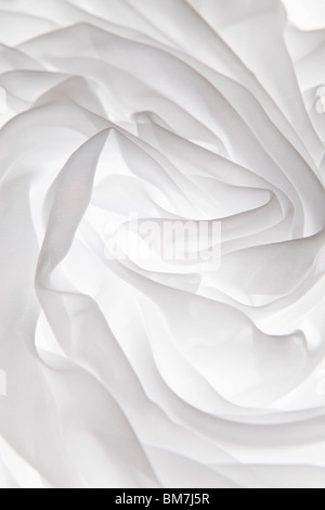 Detail of white fabric folded on a light box Stock Photo