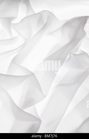 Detail of white fabric draped on a light box Stock Photo