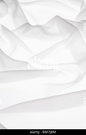 Detail of white fabric draped on a light box Stock Photo