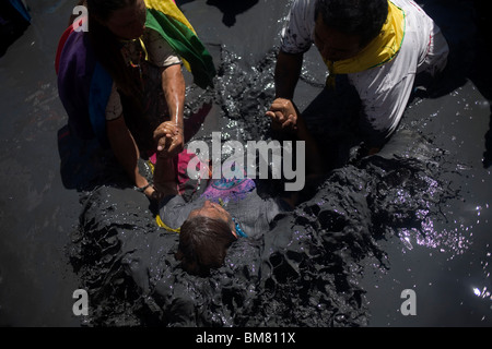 Young woman in the mud pool at the Przystanek Woodstock - Europe's ...