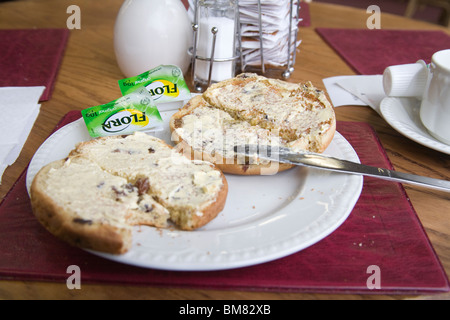 Close up Toasted teacake spread with Flora margarine Stock Photo