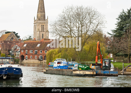 Dredger working along the River Thames in the centre of Abingdon in Oxfordshire, Uk Stock Photo