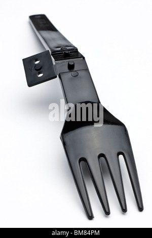 Black plastic fold away fork Stock Photo