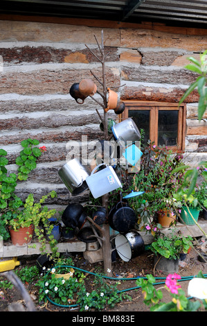 Pots and pans hanging on tree outside house in Santiago Apoala, Mexico Stock Photo