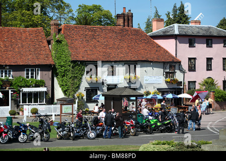 Bikers gather outside The Fox Inn pub in the picturesque village of Finchingfield in Essex, England. Stock Photo