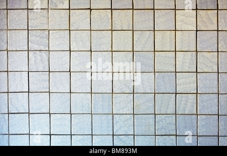 Wall covered with an old grey tile - a background Stock Photo