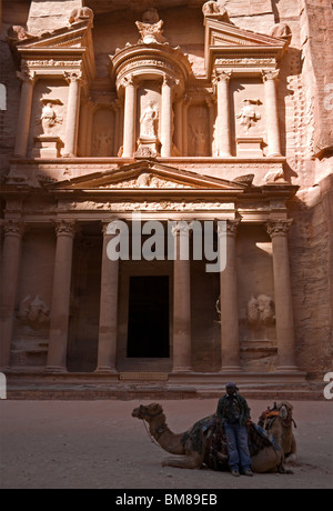 Treasury facade, with a camel in front, in the ancient rose-red city of Petra Jordan Stock Photo