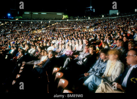 Audience at outdoor concert by Pacific Symphony Orchestra Irvine Meadows California night listen alert intent  attention perform Stock Photo