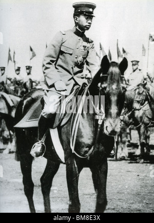HIROHITO - Emperor of Japan (1901-89) takes the salute at a military parade about 1936 Stock Photo