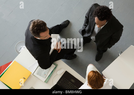 Business people in office having informal meeting Stock Photo