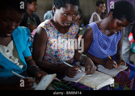 Adult education, a mathematics lesson at a school supported by an international NGO in a village in southern Malawi Stock Photo