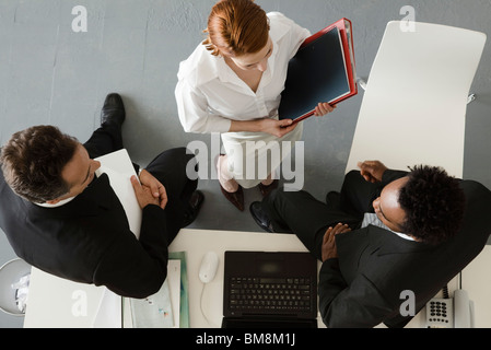 Business people in office having informal meeting Stock Photo