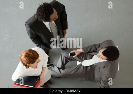 Business people having informal meeting, overhead view Stock Photo