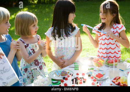 Children at outdoor birthday party Stock Photo