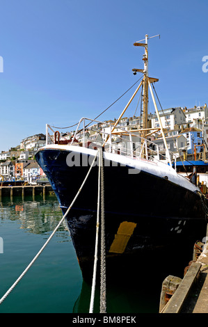 a trawler moored in the harbour at brixham in devon, uk