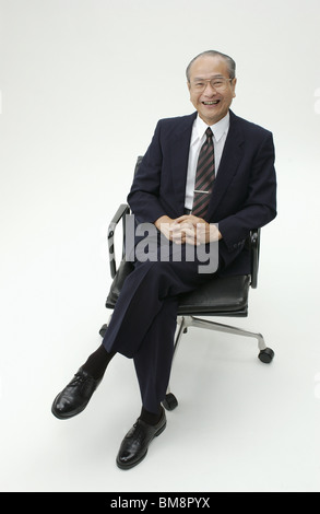 Portrait of Senior Man in Business Suit Stock Photo