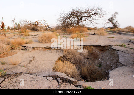 Israel, Dead Sea Damage caused by a sinkhole. The sinkholes are caused by the receding water level of the Dead Sea Stock Photo