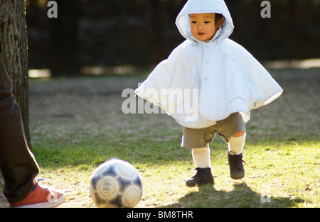 Baby boy playing soccer, Tokyo Prefecture, Honshu, Japan Stock Photo