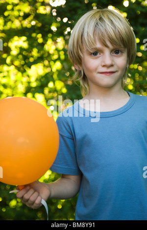 Boy with balloon, portrait Stock Photo