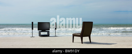Home theater and chair on beach Stock Photo