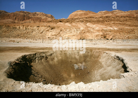 Israel, Dead Sea A sinkhole caused by the receding water level of the Dead Sea Stock Photo