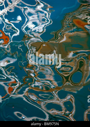 Abstract Reflection of Fishing Boat in Ocean Stock Photo