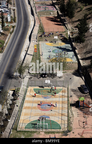 Aerial view of concrete football pitches with basketball courts in the Parque Urbano Central alongside Avenida del Poeta, La Paz, Bolivia. Stock Photo