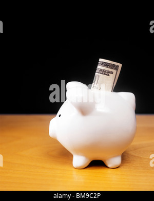 Still-life of a Piggy or coin savings Bank on desk Stock Photo