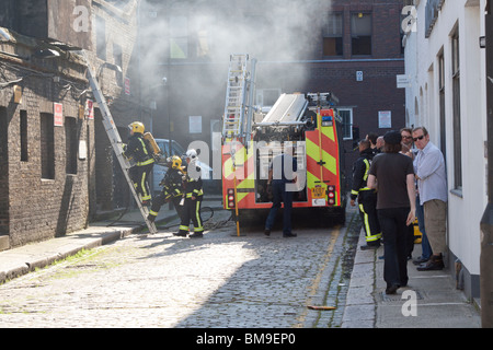 London Fire Brigade Tackling Fire - Camden Town - London Stock Photo