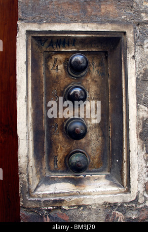 Ancient doorbell in Siena, Italy Stock Photo