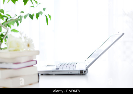 Laptop on desk in office Stock Photo