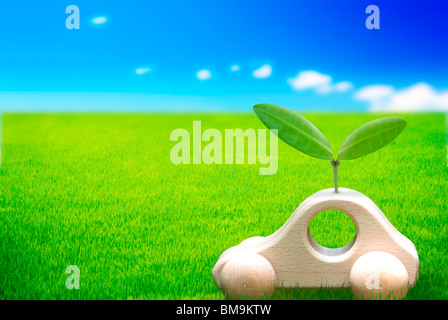 Toy car with seedling on grass, computer graphic Stock Photo