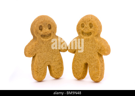 two plain gingerbread men on a white background Stock Photo