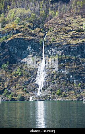 Beautiful Cascading Waterfall Flowing into Aurlandsfjorden fjord near Aurland Town Norway Stock Photo