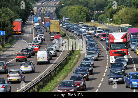 Aerial view slow moving car & lorry truck traffic in queues in both directions A12 trunk road dual carriageway busy route to and from East Anglia UK Stock Photo