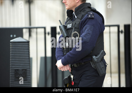 Male Armed Metropolitan Police Officer Carrying A Gun Outside ...