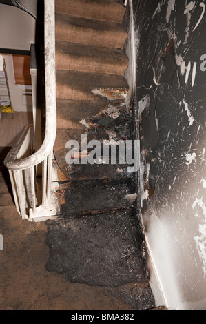 Fire on landing stairs of house Stock Photo