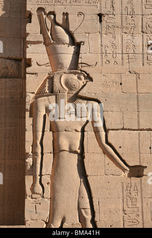Relief of the Egyptian God Horus on the wall of the first pylon at the Temple of Philae in Egypt Stock Photo
