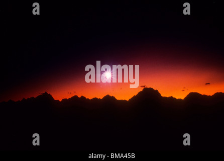 Brilliant star over mountain range. Stock Photo