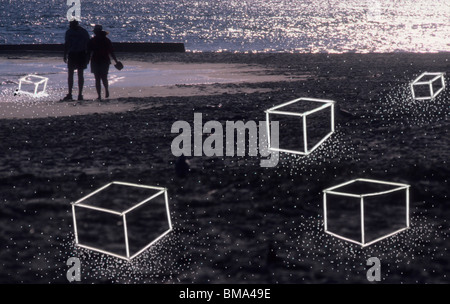 Couple on surreal beach landscape. Stock Photo