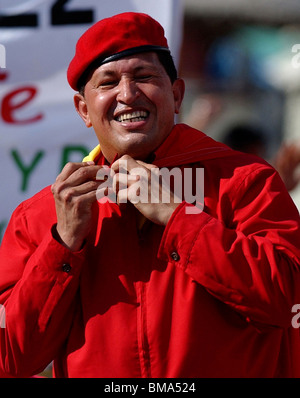 Venezuela's President Hugo Chavez wearing his iconic red beret smiles to supporters at a political rally in Caracas, Venezuela. Stock Photo